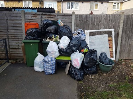 Construction site with waste management activities in Forest Gate